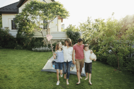 Happy family playing outside