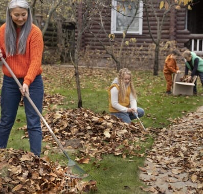 Cleaning the backyard - Beeline Pest Control Family cleaning the backyard